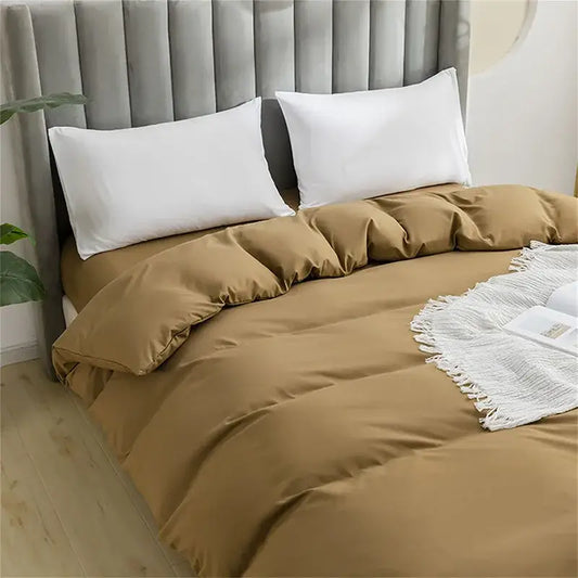Quilted tan duvet cover set with matching pillowcases featuring a soft textured fabric for comfortable bedding