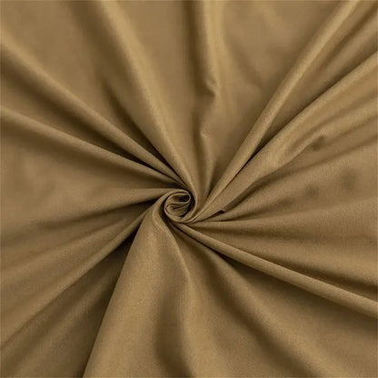 Quilted tan duvet cover set with smooth textured fabric and subtle sheen featuring gentle folds in soft bedding cover set