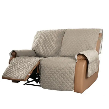 Beige quilted fabric sofa protector with diamond stitching and brown leather trim for recliner slipcover use