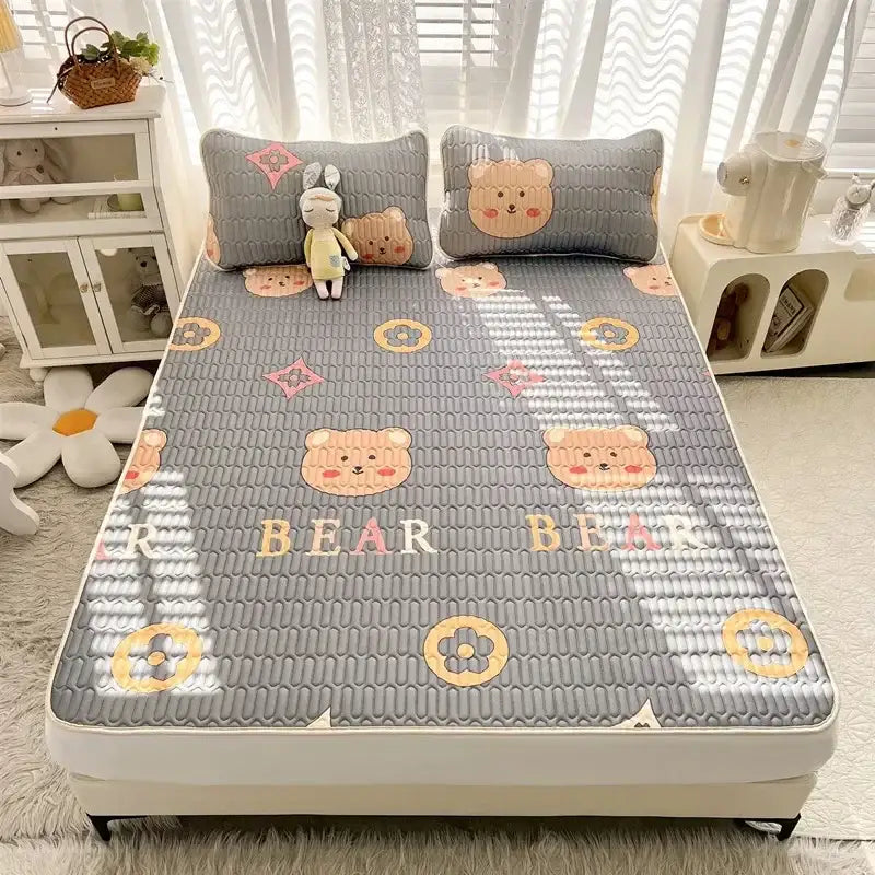 Gray quilted cooling mattress pad with cartoon print bear faces and floral patterns from decorbites mattress set