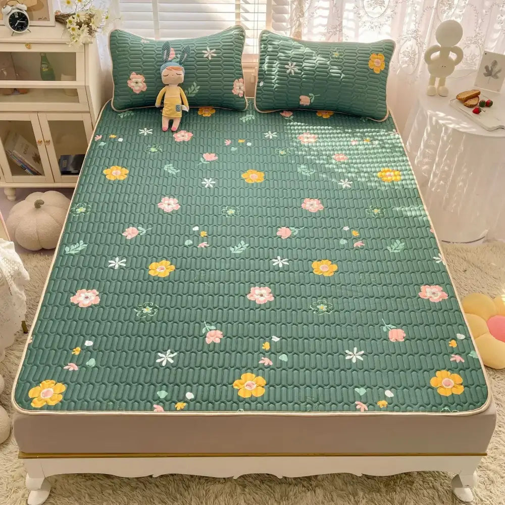 Green floral-patterned quilted bed pad with yellow pink white flowers from decorbites cartoon print mattress set