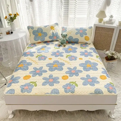 Blue and yellow floral quilted bed pad with cream base part of rainbow striped cartoon print mattress set decorbites cartoon print