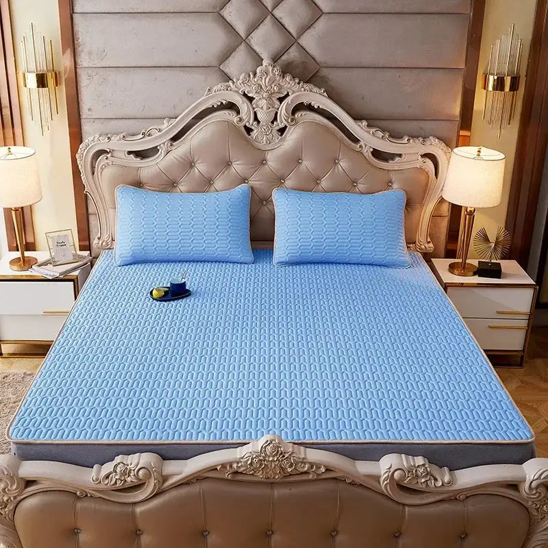 Light blue quilted mattress pad with textured pattern and gray border for decorbites cartoon print mattress set