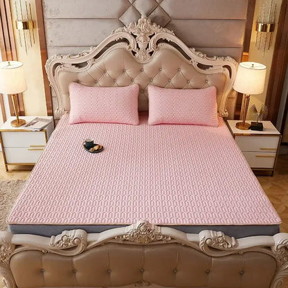 Pink quilted mattress pad with subtle texture on ornate bed frame part of decorbites cartoon print mattress set