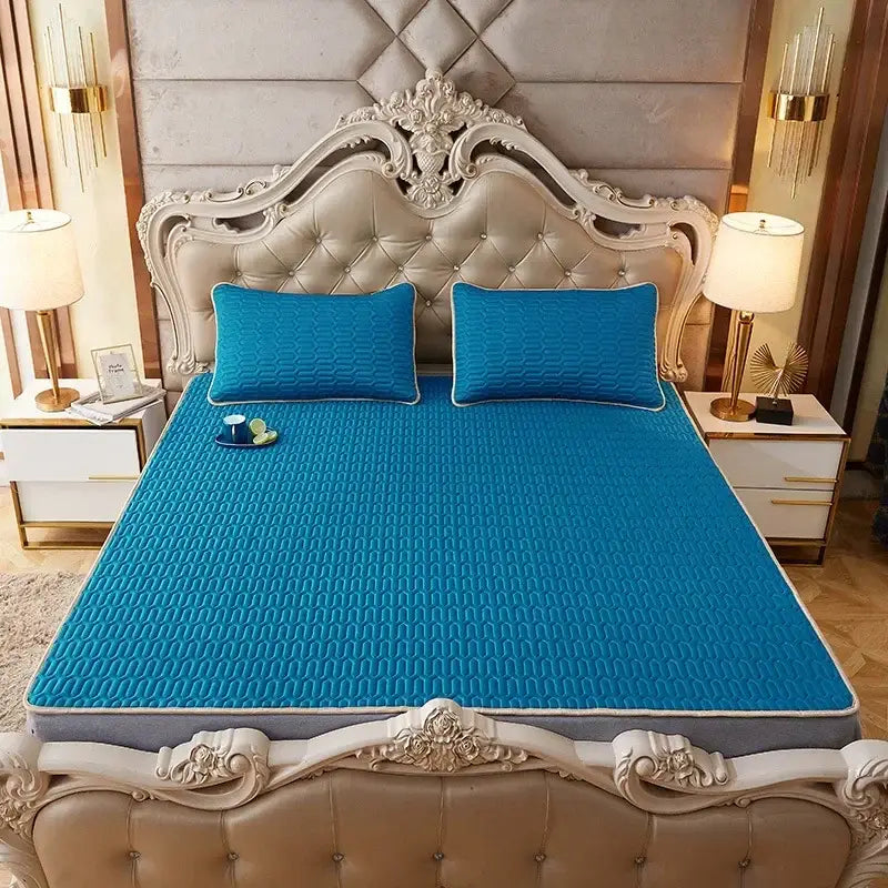 Bright blue quilted cooling mattress pad with textured surface and gray border for decorbites cartoon print mattress set