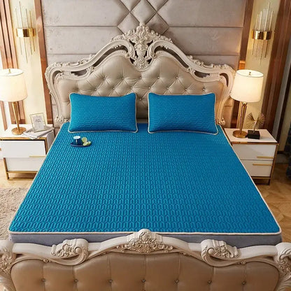 Bright blue quilted cooling mattress pad with textured surface and gray border for decorbites cartoon print mattress set