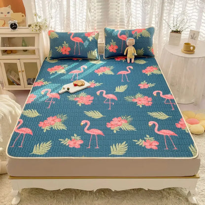 Blue quilted bed pad with pink flamingo and floral patterns in a decorbites cartoon print mattress set