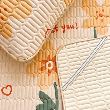 Cream-colored quilted car seat cover with honeycomb texture and orange green floral print from decorbites cartoon print mattress set