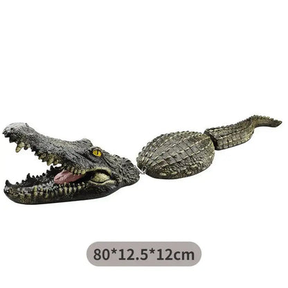 Realistic dark green plastic crocodile head decorbites garden water floating animal with textured scales and yellow eyes