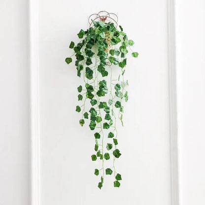 Green artificial ivy plant hanging from decorative metal hook from decorbites ivy bar living room decor