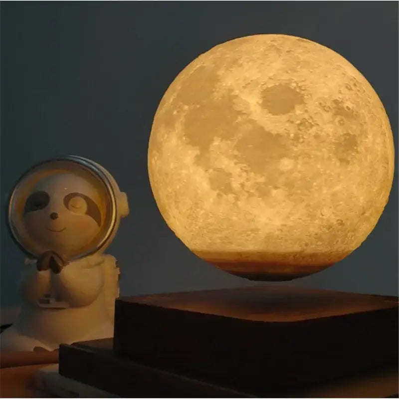 Floating decorbites levitating moon lamp glowing golden to deep amber with detailed craters for bedroom night light