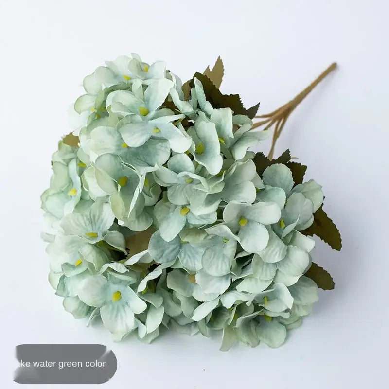 A delicate decorbites hydrangea branch decor in soft watercolor green with yellow centers and realistic leaf accents for living room or wedding use