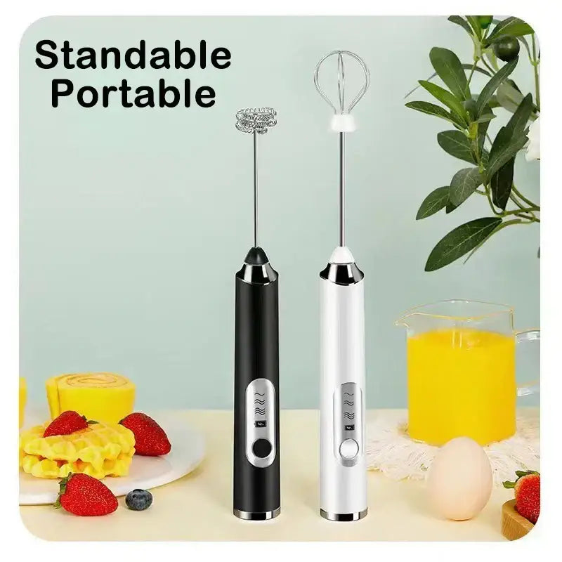 Two rechargeable electric milk frother mixers in black and white with metallic finish and whisk attachments for kitchen use