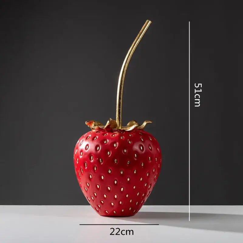 Red and gold strawberry figurine home decor crafted from glossy resin with gold stem and leaf by decorbites gold strawberry