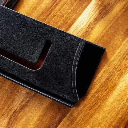 Black textured plastic knife blade protector cover with sleek modern design and cutout slot for easy access