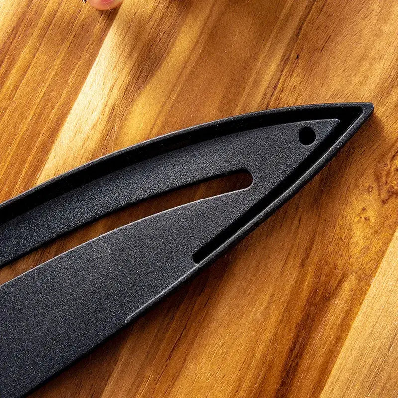 Black matte-finished knife sheath with textured surface and elongated slot design as a knife blade protector cover