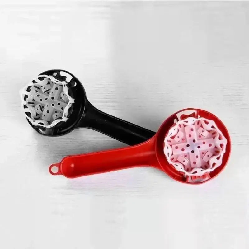 Red and black plastic espresso coffee machine cleaning tool with perforated star-like coffee machine brush interior design