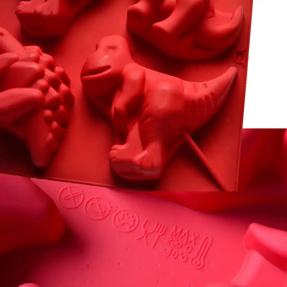 Red dinosaur silicone cake mould with textured details and embossed safety markings for kitchen and decorbites dinosaur silicone use