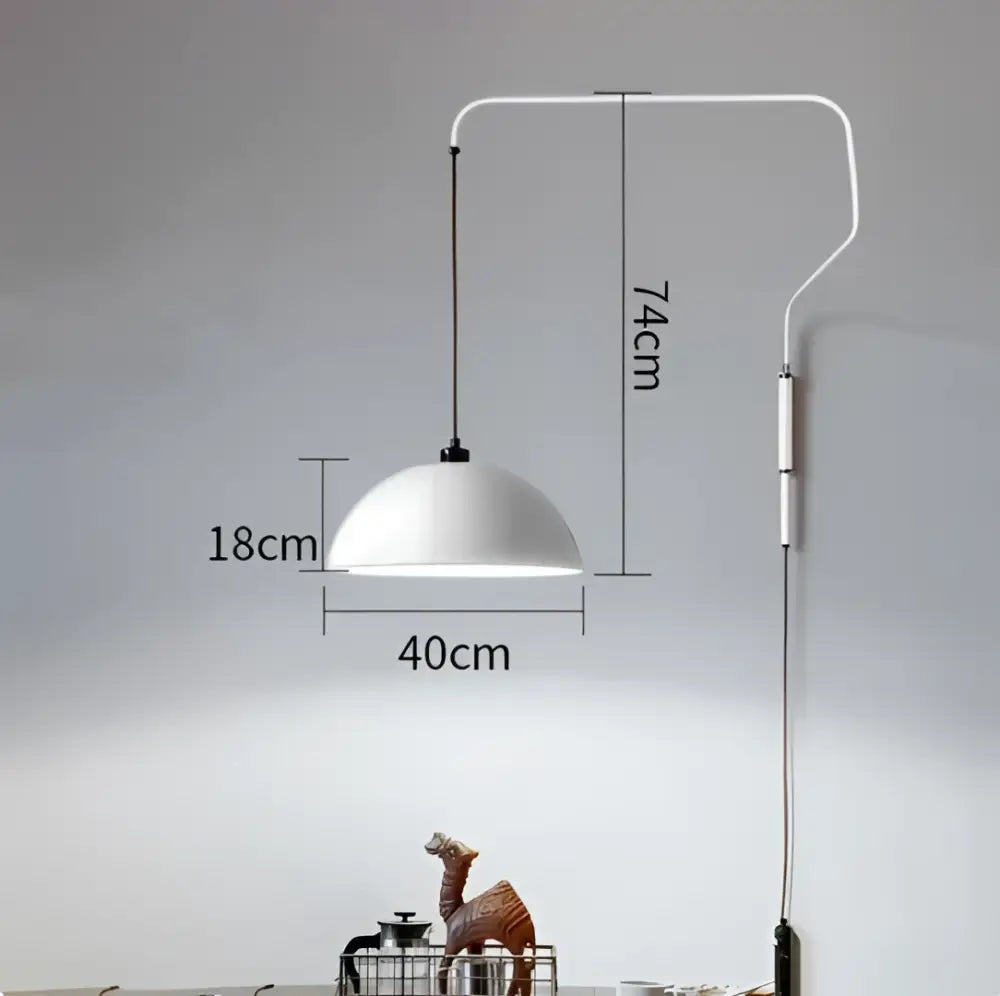 White enamel dome adjustable pendant light with a sleek curved wall-mounted arm for kitchen island lighting