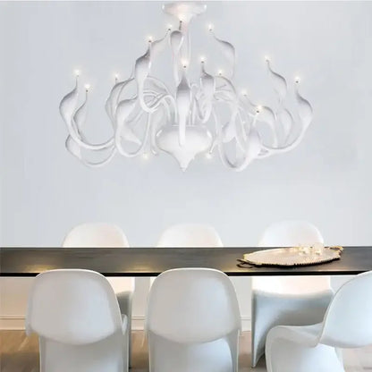 A modern white iron swan pendant lamp with flowing organic arms and embedded lights ideal for living rooms