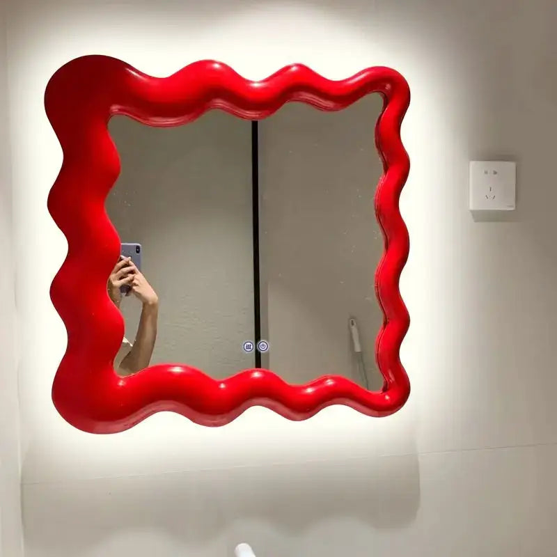 Vibrant red glossy cream cloud wave mirror with wavy edges for bedroom makeup decor by decorbites cream cloud