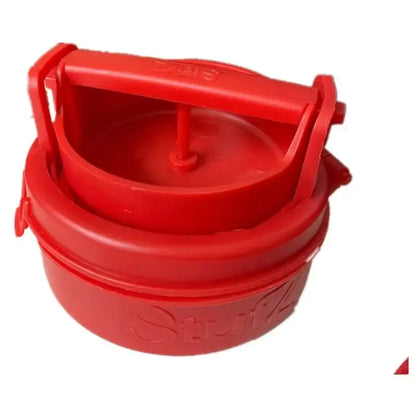 Red plastic hamburger meat presser with handle and embossed stufz branding for filling maker use