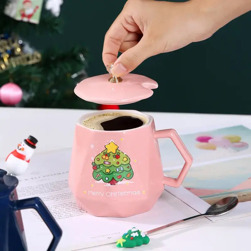 Pink ceramic christmas mug with lid featuring festive tree design and merry christmas text in ceramic mug set