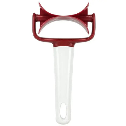 Red and white plastic vegetable peeler with curved ergonomic handle ideal for use as a dough press cutter tool
