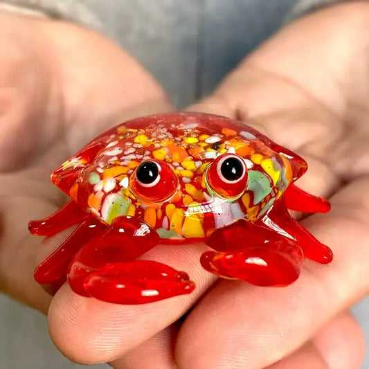 A vibrant red decorbites crab glass figurine with colorful speckles and detailed glossy eyes for living room art decor