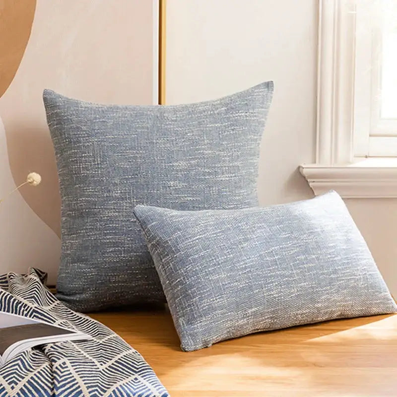 Two gray textured pillow covers with a subtle woven pattern in a decorbites linen throw pillow set for living room decor