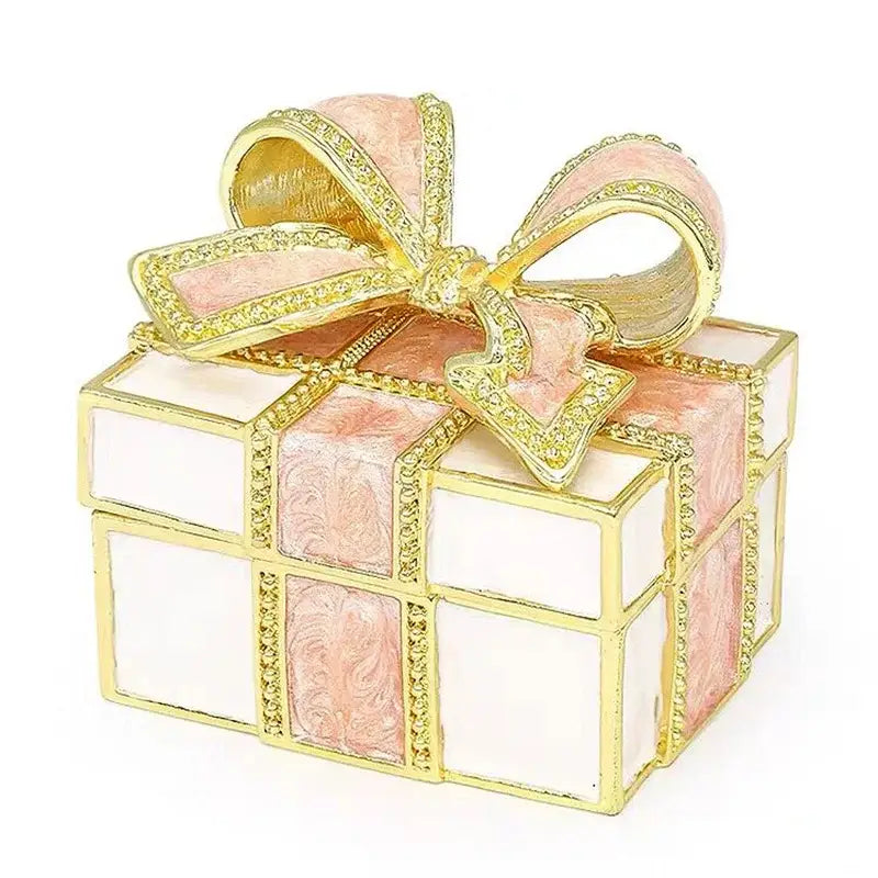 A delicate red and white jewelry trinket box with a gold-trimmed bow featuring sparkling rhinestones for bedroom gifts