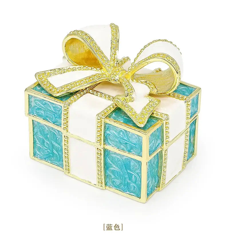 Turquoise and white jewelry trinket box with gold-trimmed rhinestone bow for bedroom gift storage