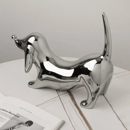 Shiny chrome plated dachshund art statue with elongated body and raised tail for home decorbites doberman decor