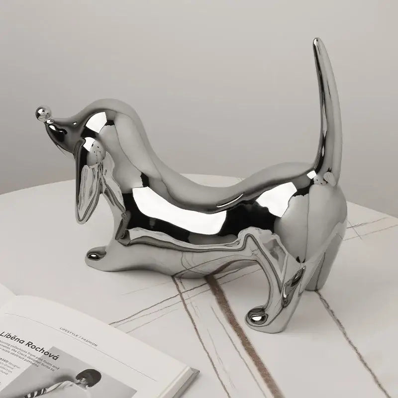 Shiny chrome plated dachshund art statue with elongated body and raised tail for home decorbites doberman decor