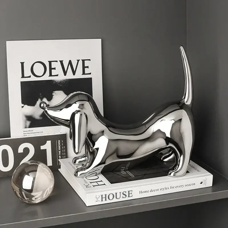 Shiny chrome-plated decorbites doberman art statue in reflective silver perfect for modern home decor
