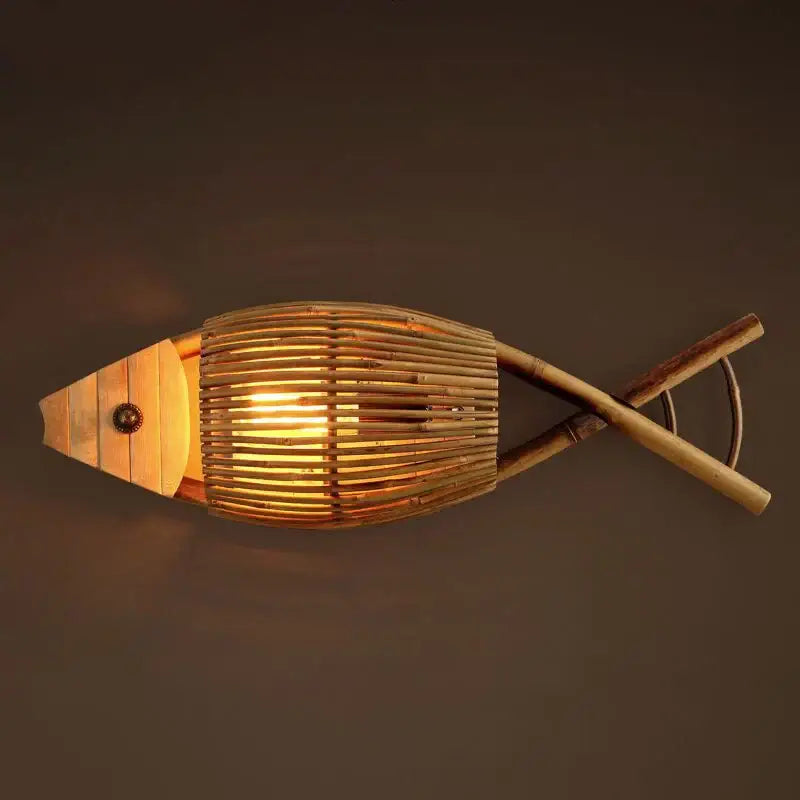 A warm-toned retro bamboo fish wall lamp with a slatted body and wooden fins for living room decorbites bamboo fish decor