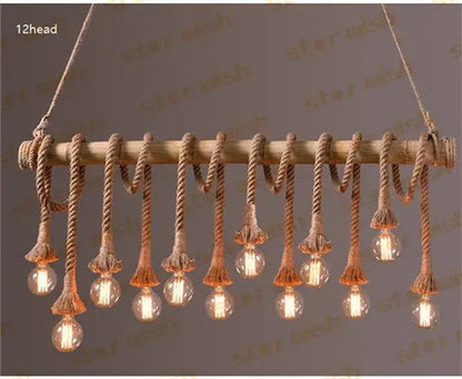 Rustic wooden beam pendant lights with twelve hanging edison bulbs suspended by natural bamboo hemp rope decorbites