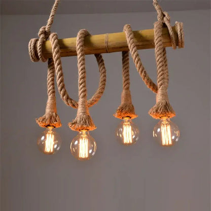 Rustic pendant lights featuring rope wrapped bamboo hemp rope with four glowing filament bulbs for dining room decorbites bamboo hemp chandelier