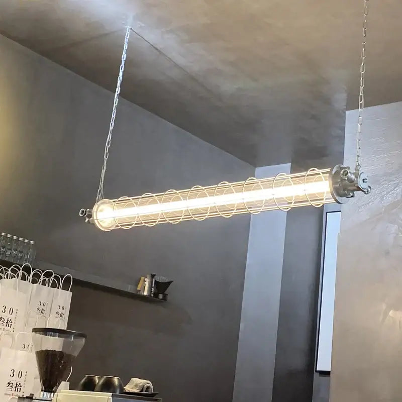 Retro bar industrial metal cage chandelier featuring a fluorescent tube encased in concentric metal rings by decorbites industrial
