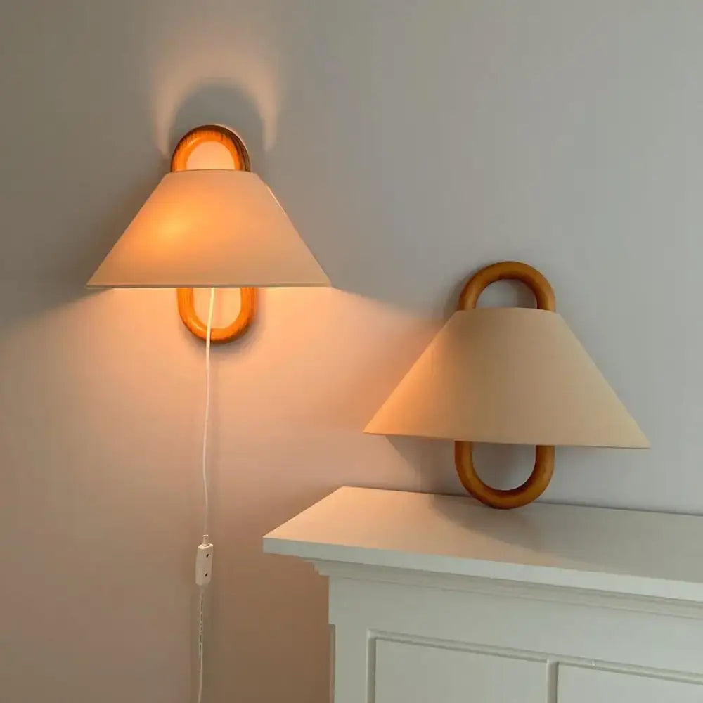 Retro beech wood wall lamp with warm-toned wooden ring sconces and cream-colored conical shades for bedroom use