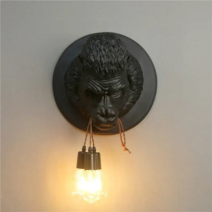 Retro black gorilla resin wall sconce with textured fur and a single exposed bulb for bedroom decorbites gorilla resin use