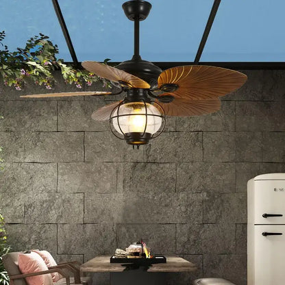 Black wrought iron retro fan light with wooden leaf-shaped blades and globe light fixture with remote control for living room