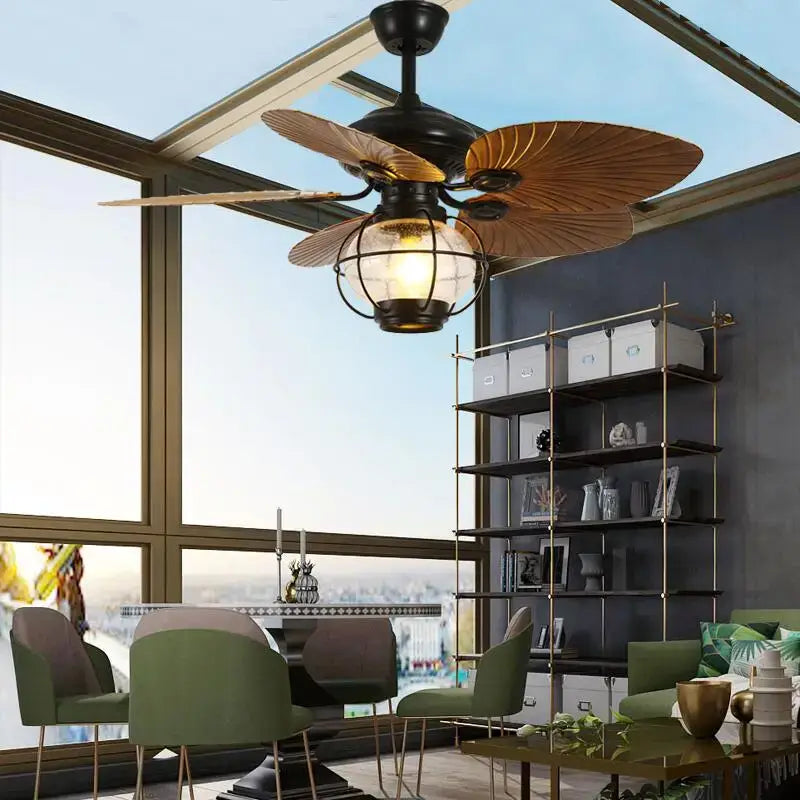 Retro black iron fan light with remote control featuring wooden leaf blades and vintage glass globe for living room use