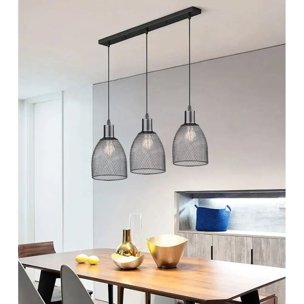 Retro black metal cage bell pendant light with decorbites cage bell design hangs above dining table as pendant light decor