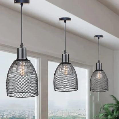 Three black metal decorbites cage bell pendant lights with diamond-patterned mesh shades for dining room decor