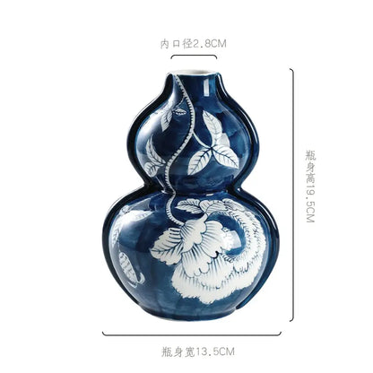 Retro blue and white porcelain vase in deep blue ceramic with intricate white floral and vine patterns for living room decorbites blue white