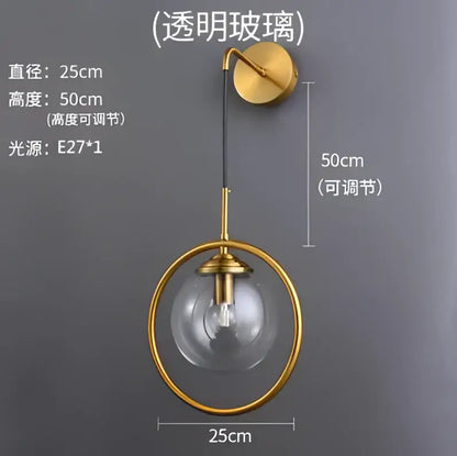 Gold-toned retro brass wall lamp with decorbites glass ball led globe and adjustable height diameter 50cm bathroom sconce