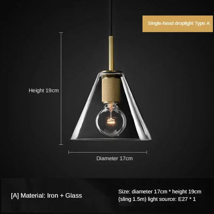 A sleek retro brass and glass pendant light with clear conical shade and iron frame ideal for dining room decorbites gold led