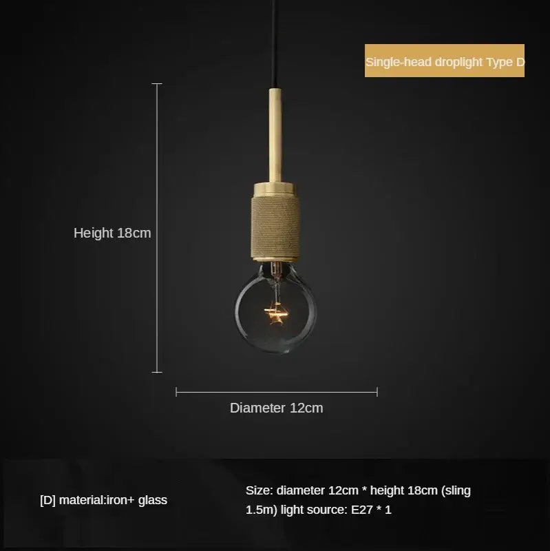 A single-head retro brass and glass led pendant light with textured cylindrical shade and clear bulb for dining room decorbites gold led