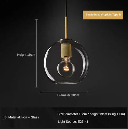 A sleek glass globe pendant light with brass finish and decorbites gold led for dining room LED pendant decor